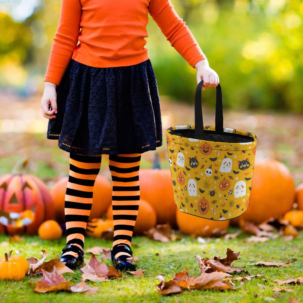 Child with Halloween tote bag, ghost and pumpkin pattern, perfect for trick-or-treating
