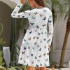White round neck baggy dress with butterfly print, long sleeves and side pockets