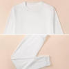 White boy's pajama top, crew neck design, soft polyester blend, comfortable sleepwear.