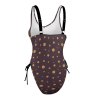 Brown polka dot one-piece swimsuit, adjustable straps, side tie detail