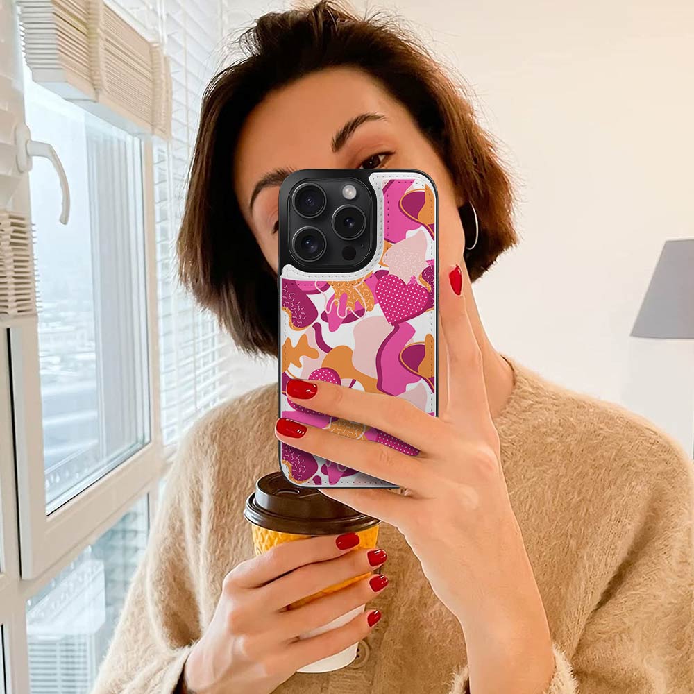 Woman holding iPhone 15 with floral print case, card slot design, stylish and full protection.