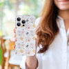 iPhone 13 case held by a woman, PC plastic with a colorful pattern, phone protection.