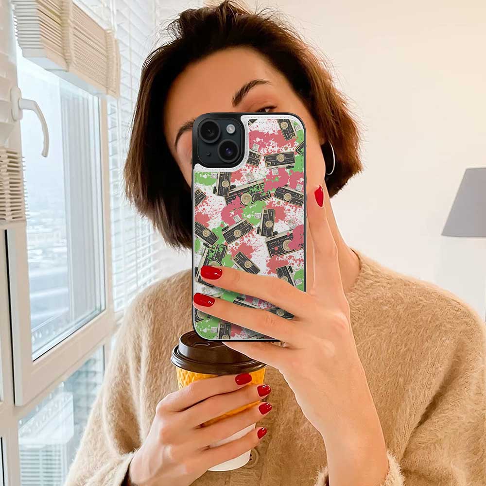 Woman holding iPhone 15 with floral print case, card slot design, stylish and full protection.