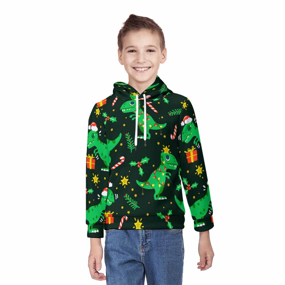 Youth all over print hoodie featuring a green dinosaur pattern with a zipper on a young person.