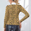 Women's leopard print lapel sweater with white turtleneck, perfect for winter fashion.