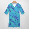 Blue leaf-patterned 7-point sleeve dress with V-neck, suitable for work or travel.