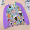 Raglan round neck sweater with cartoon donut print and purple sleeves. Comfortable polyester-cotton blend.