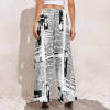 Black & white newspaper print wide leg pants, polyester. High-waisted design.