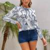 Women's white long sleeve shirt with blue paisley pattern, polyester-spandex blend, perfect for casual wear