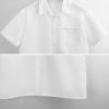White short-sleeved shirt, 100% polyester, perfect for spring and autumn. Featuring a retro V-neck design.