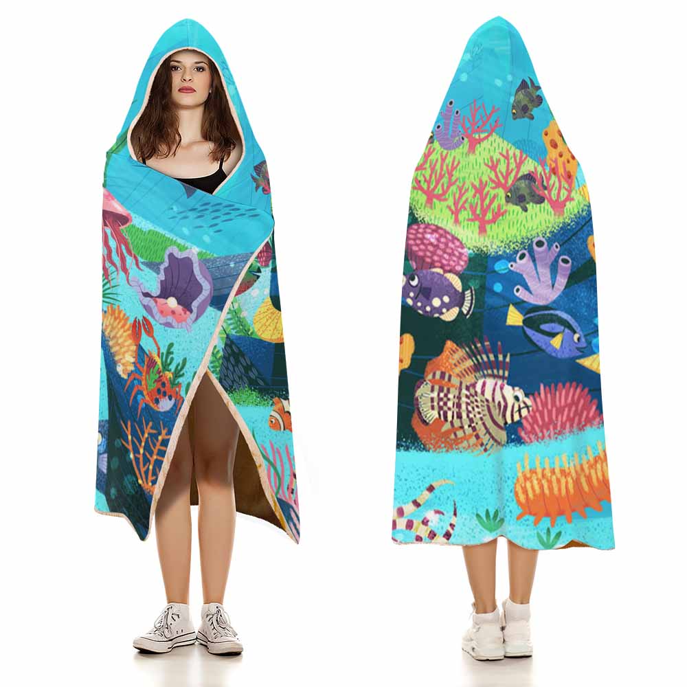 Cloak Hooded Blanket featuring an underwater coral scene, perfect for cozy lounging in Arctic Velvet material