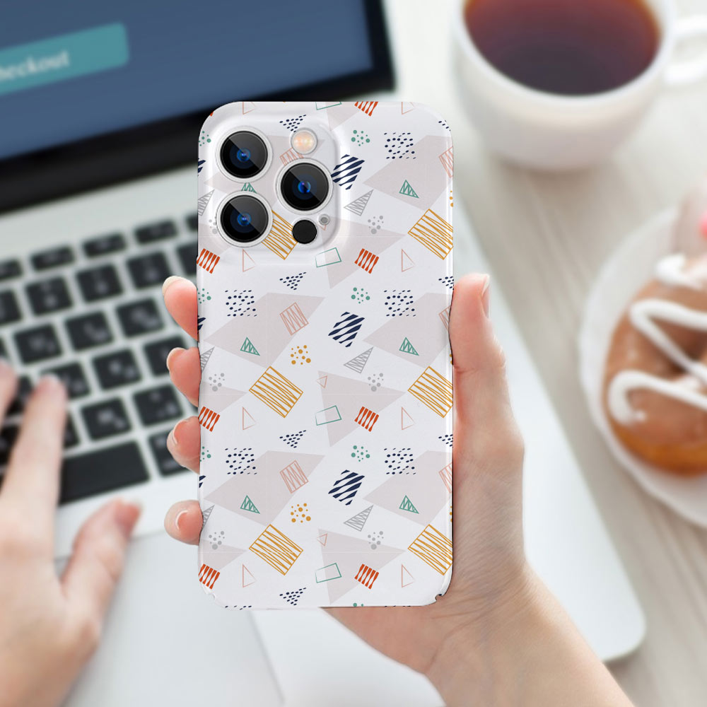 iPhone 13 PC plastic case with colorful pattern, phone protection, held by a person.