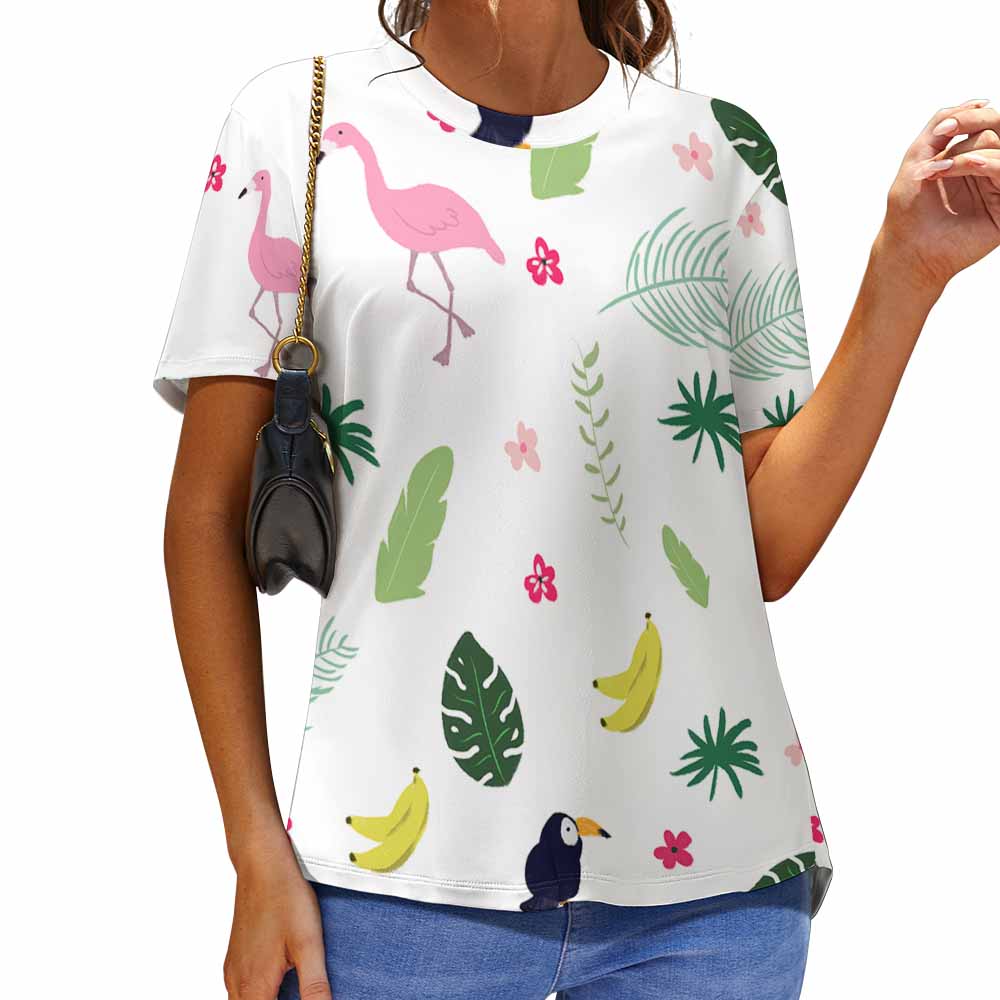 Women's white print t-shirt with flamingo and tropical leaf patterns. Comfortable, breathable fabric.