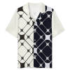 Men's ice silk pajama top with geometric pattern in cream and navy. V-neck, short-sleeved sleep shirt.