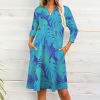 Blue leaf-patterned 7-point sleeve dress with pockets, V-neck, suitable for work or travel.