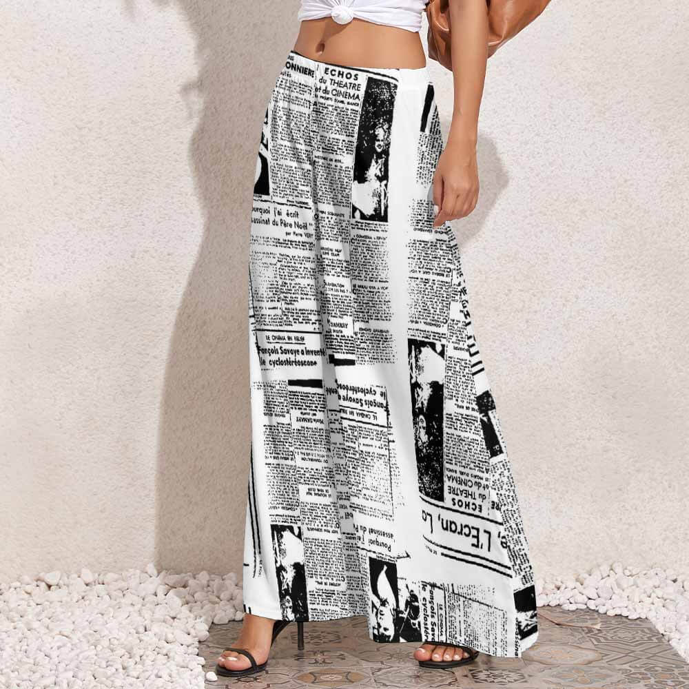 Women's wide-leg pants in black and white newspaper print, made of polyester, high-waisted design.