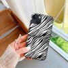 iPhone 13 case with black and white zebra print, TPU material, scratch-resistant and wireless charging compatible