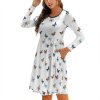 Round neck baggy dress with butterfly pattern, featuring side pockets and a comfortable fit.