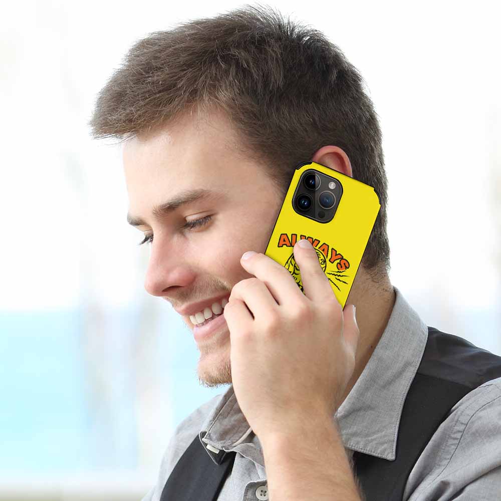 Man on iPhone 14 with yellow 'ALWAYS HUNGRY' fiber skin case, stylish.