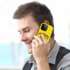 Man on iPhone 14 with yellow 'ALWAYS HUNGRY' fiber skin case, stylish.