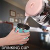 Stainless steel insulated drink cup with cartoon design, filled with liquid, featuring spill-proof lid.