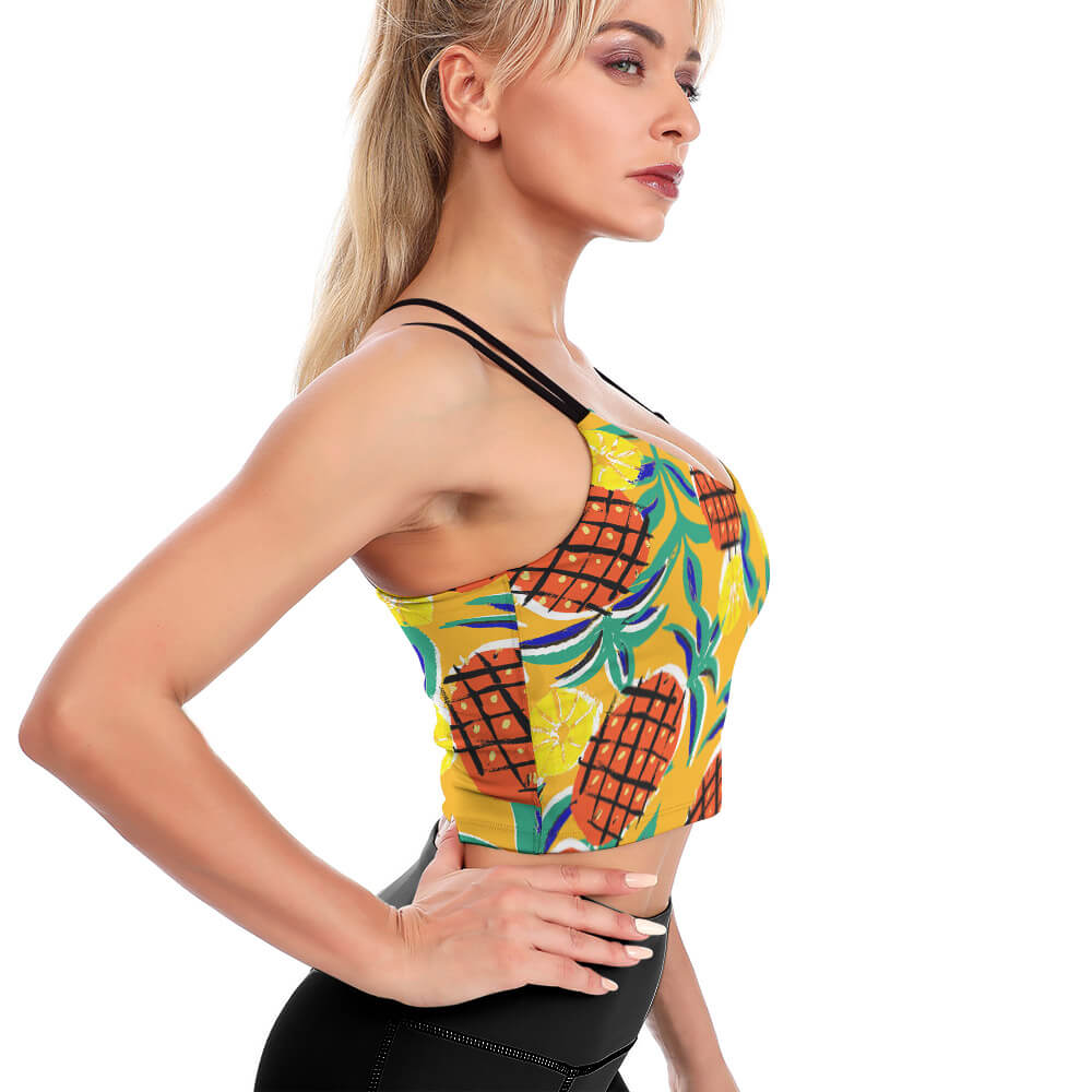 Yellow pineapple print cropped yoga top, perfect for workouts, with a stylish cross-back design.