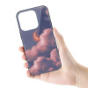 iPhone 14 glass case with cloud design held in hand, showcasing protective features and stylish design.