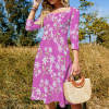 Sweetheart knot flare dress with floral print, mid-length sleeves, and a cinched waist in the meadow, perfect for vacation.