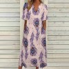 Polyester 7-point sleeve dress with V-neck, featuring a peacock feather pattern, perfect for leisure and shopping.
