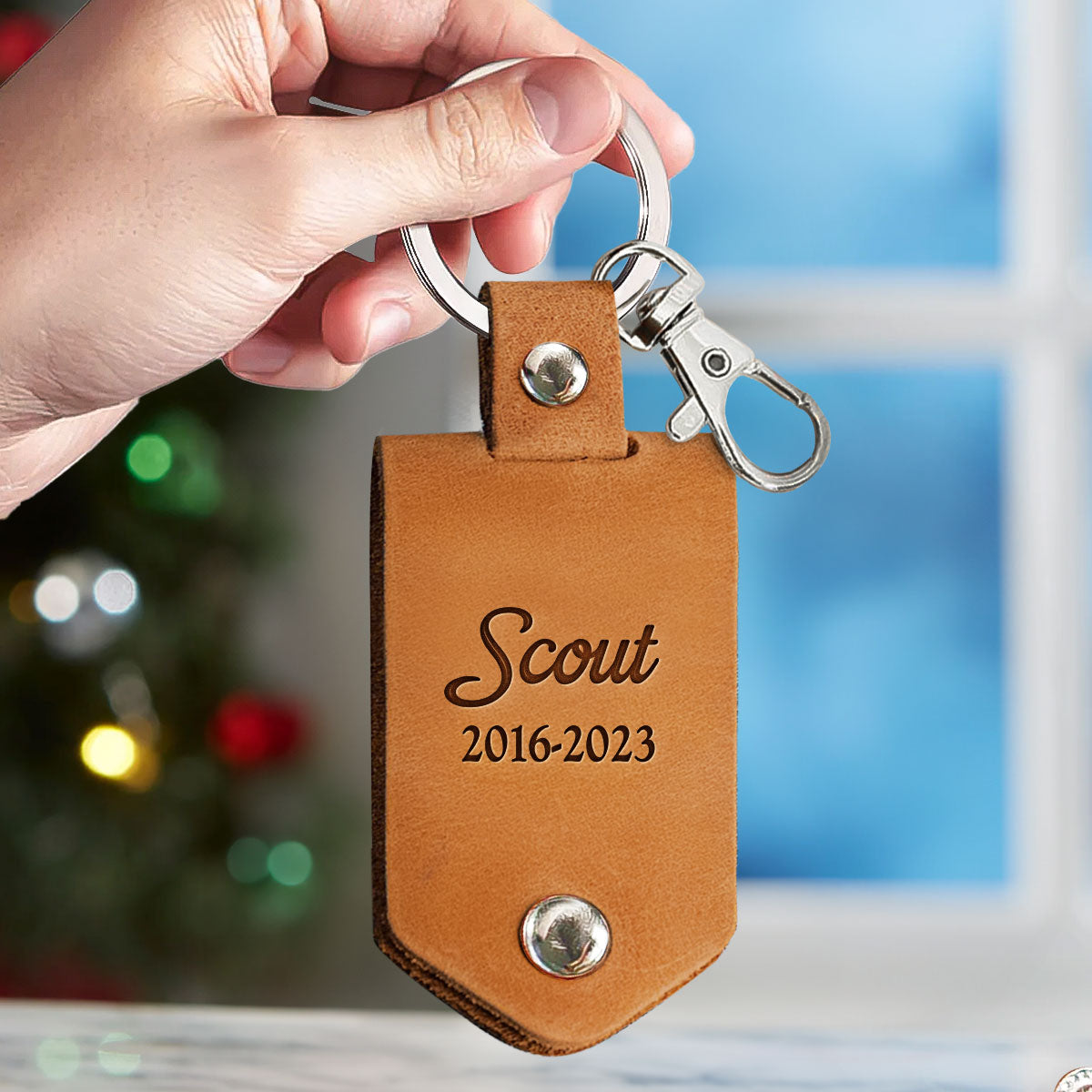 Personalized tan leather pet memorial keychain with "Scout" name and dates, Remembrance Gift