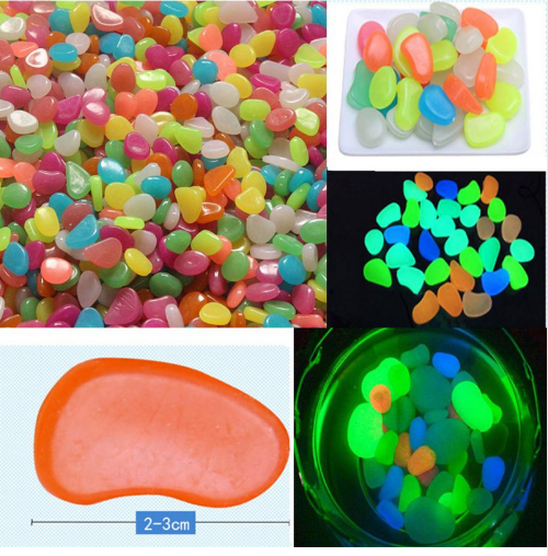 Resealable bag of glow pebbles with pebbles spilled out on a surface