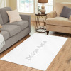 White area rug with 'Design Area' text, stain resistant and suitable for living room decor.