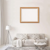 Wooden frame photo puzzle displayed above a gray sofa with decorative pillows, ideal for custom photo display
