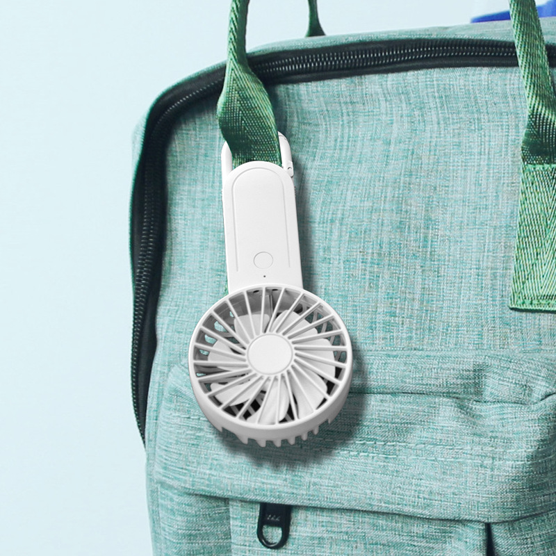 Mint, pink and white mini fans on a sunlit surface