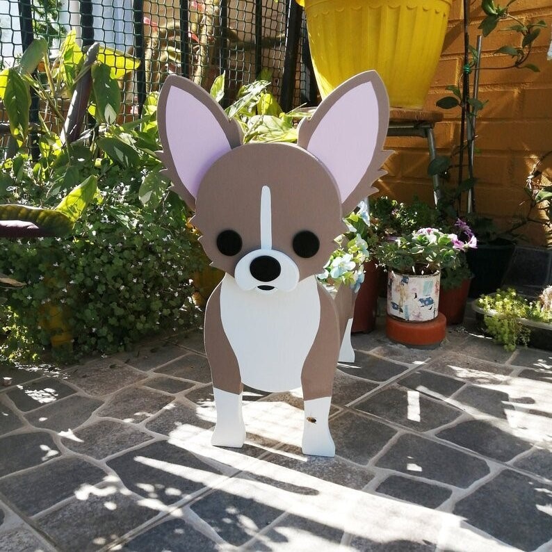Brown and white chihuahua planter with large ears showing painted facial details