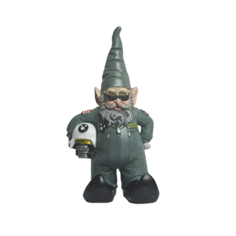 Gnome figures placed among plants along a garden path in daylight