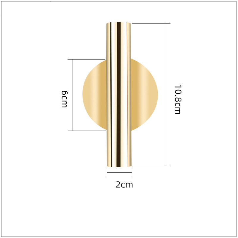 Gold wall vase disc lying flat against a light grey wall