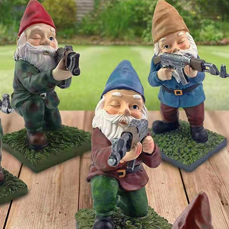 Group of armed garden gnomes on a wooden deck in daylight