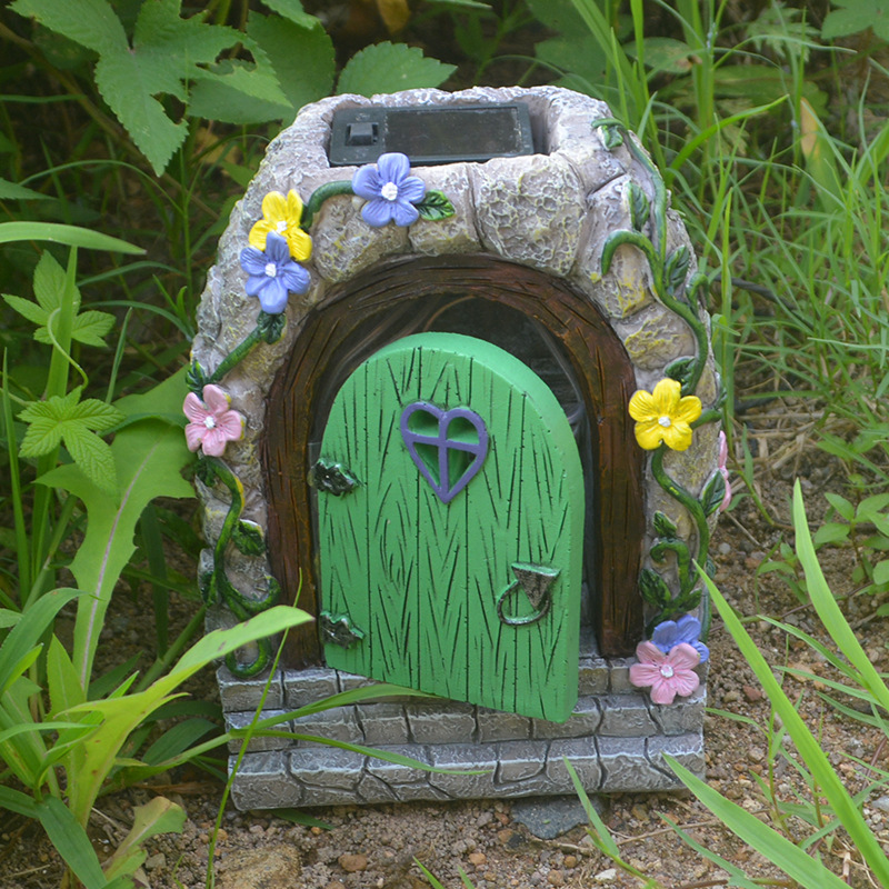 Close view of painted flowers and vines on a stone archway
