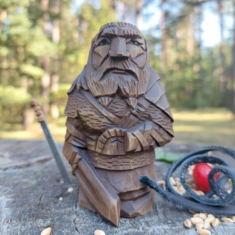 Norse figure set photographed in a styled rustic display