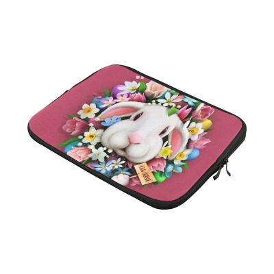 Pink 13-inch laptop sleeve with white bunny and floral design. Neoprene water-resistant material.