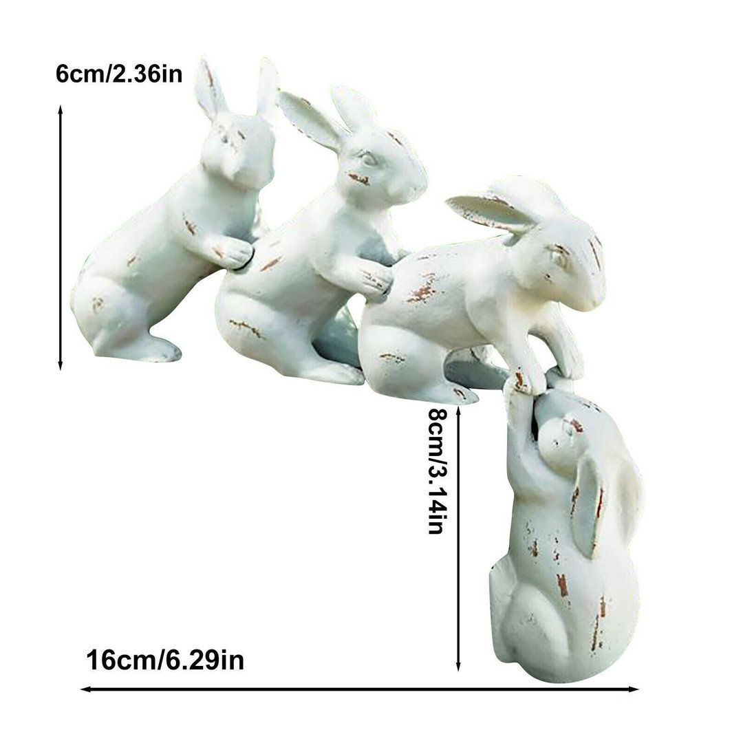 Rabbits arranged along a garden ledge with greenery between them