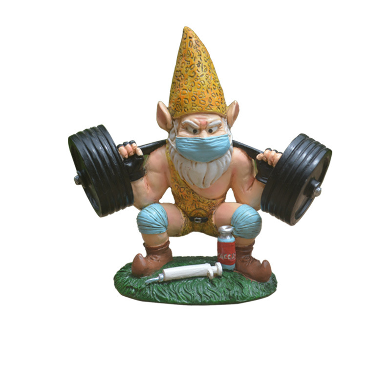 Gnome statue set on a plain garden bed with an empty corner