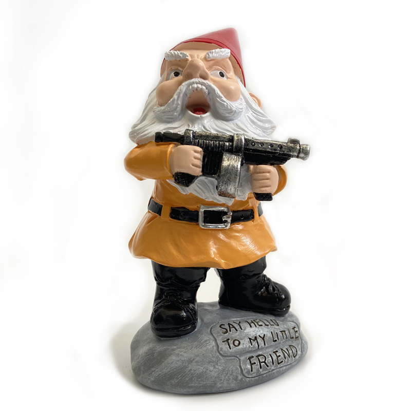 Resin gnome sitting on a garden step with a painted face