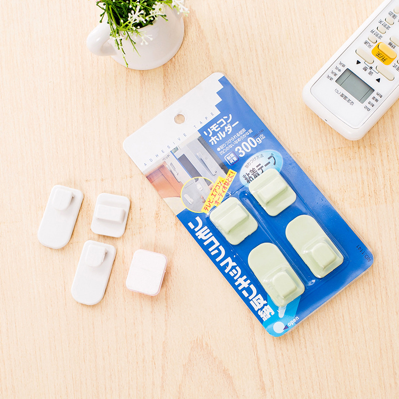 Blister pack of pastel adhesive hooks with 300g rating printed on it