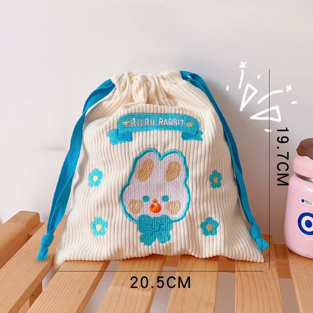 Blue-cord rabbit corduroy pouch showing embroidered front detail