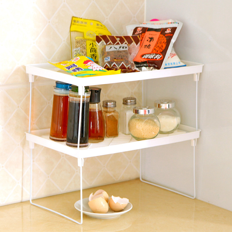 Compact two-tier rack fitted into a corner counter beside a cabinet
