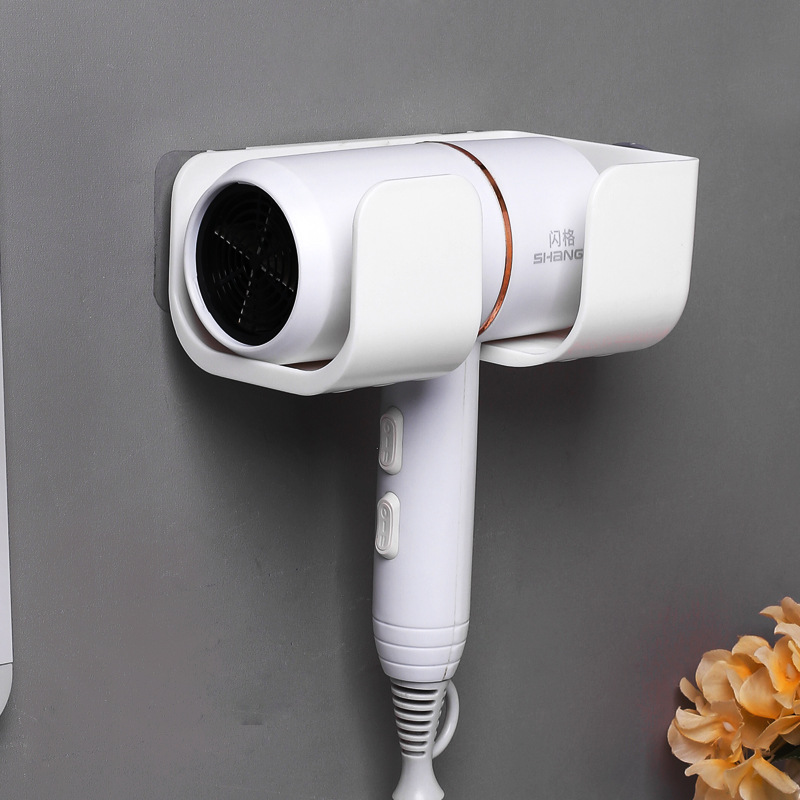 Front view of white wall bracket holding a white hair dryer, vent facing out