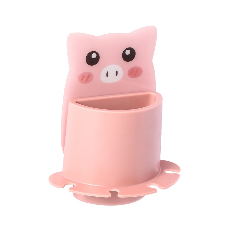 Close-up of pink pig wall cup showing scalloped suction base