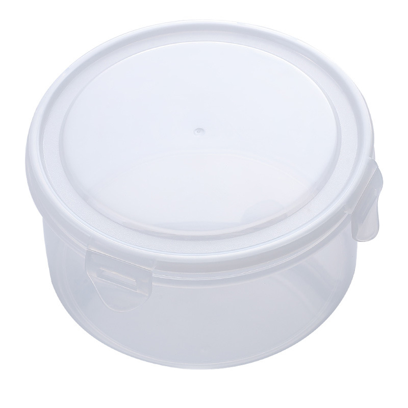 Stacked clear food boxes with white lids arranged neatly in a kitchen